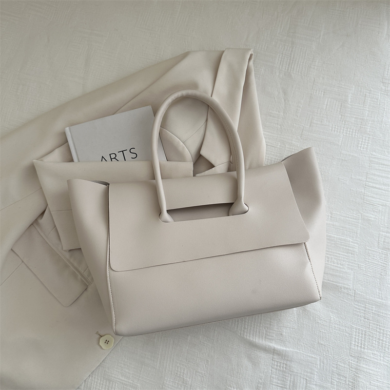 Nuevo diseño de color sólido portátil de un solo hombro fresco 2024 temperamento de otoño e invierno axilas retro de gran capacidad bolso Tott