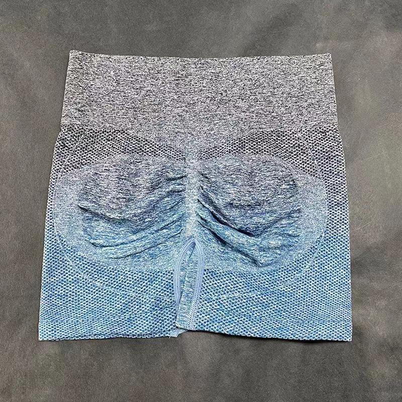 Pantalones cortos de yoga sin costuras teñidos con gradiente transfronterizo europeo y americano transpirables de las mujeres de secado rápido Melocotón Cadera apretada cintura alta estiramiento tres puntos