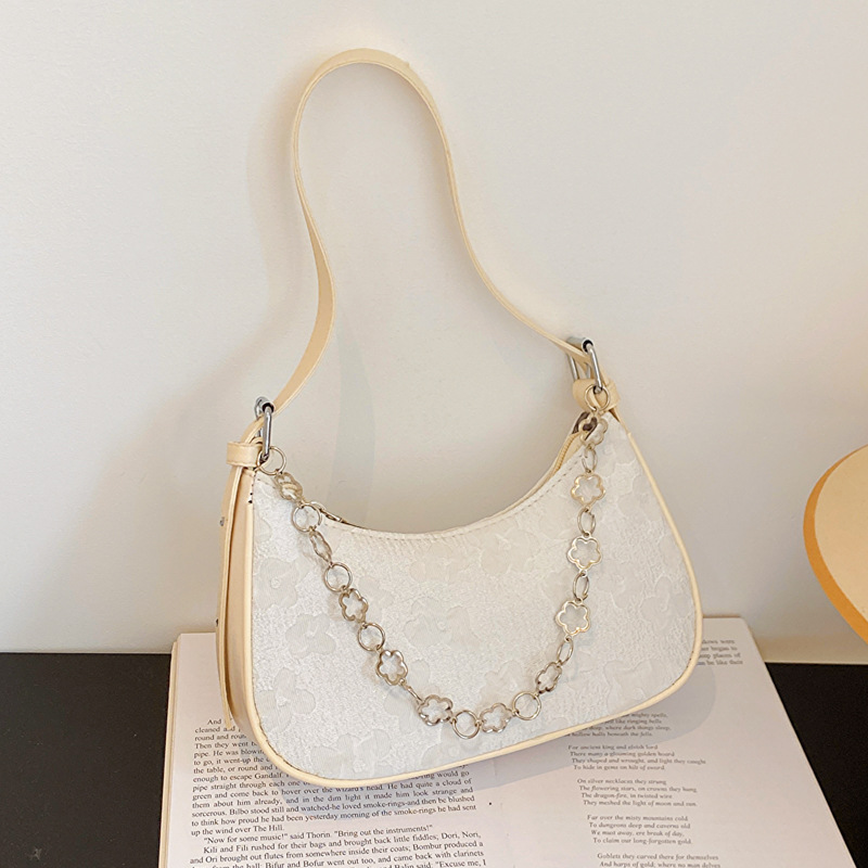 Bolso de las axilas para las mujeres 2023 nuevo bolso de mensajero de hombro de moda nicho retro ins baguette bolsa de tela tejida de encaje