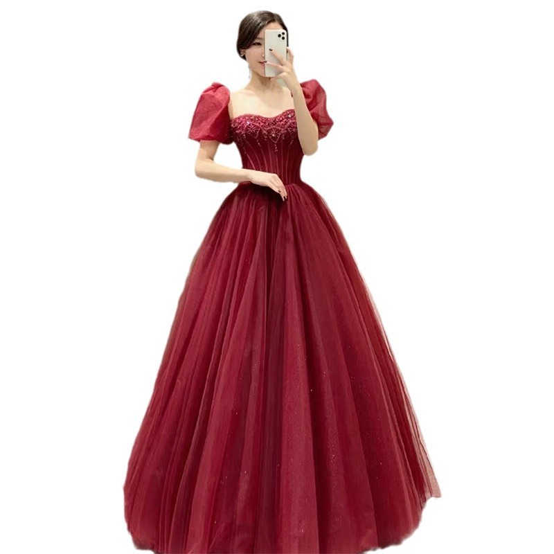 Nuevo cuello cuadrado burbuja manga vestido vino rojo 2026 estilo francés temperamento de alta sensación vestido de compromiso brindis