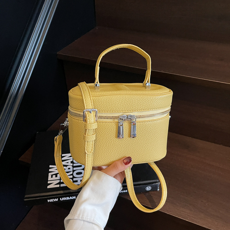 Bolso de cubo popular de este año 2025 verano nuevo bolso de hombro con patrón de lichi bolso de mensajero simple y versátil mujer