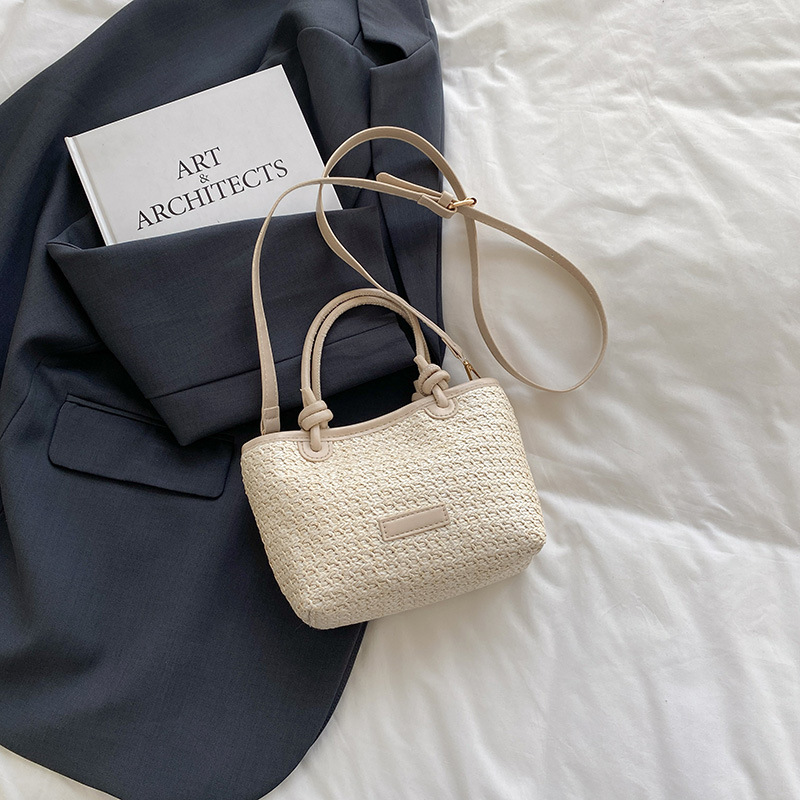 Bolso tejido estilo playa de vacaciones de primavera y verano bolso de mensajero portátil 2025 nuevo estilo nudo de cuerda de aire extranjero bolso de canasta de verduras bolso tejido