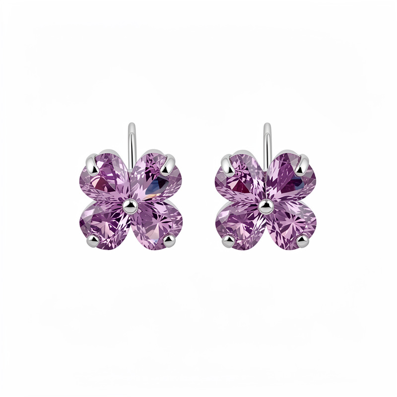 Agujas de plata zircon flores de hierba afortunada simple estilo de viaje versátil pendientes ligeros de lujo alta sensación de auriculares al por mayor