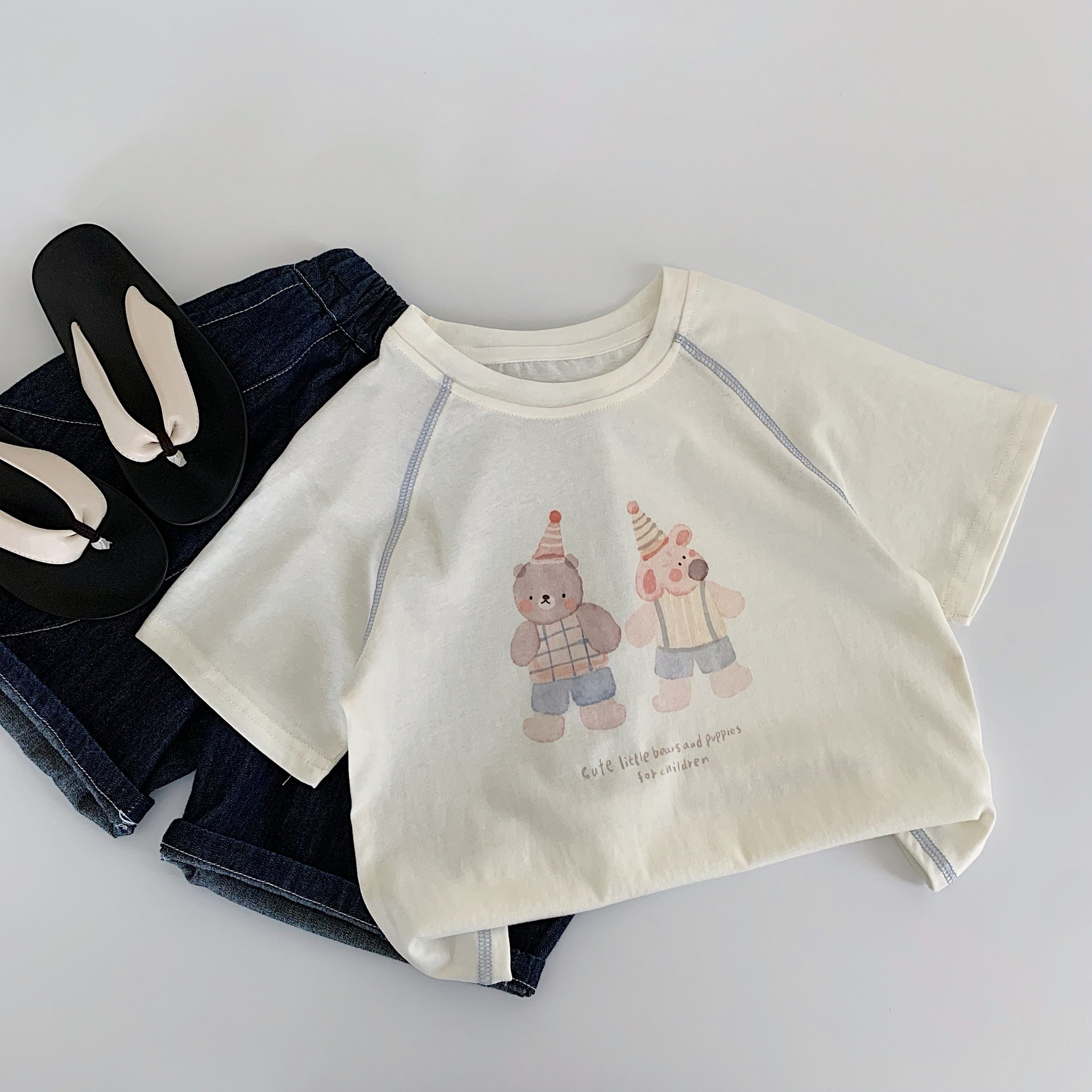 Maibao niños verano manga corta 2025 nuevos niños y niñas dibujos animados oso camiseta salvaje Huzhou Zhili ropa para niños clase a