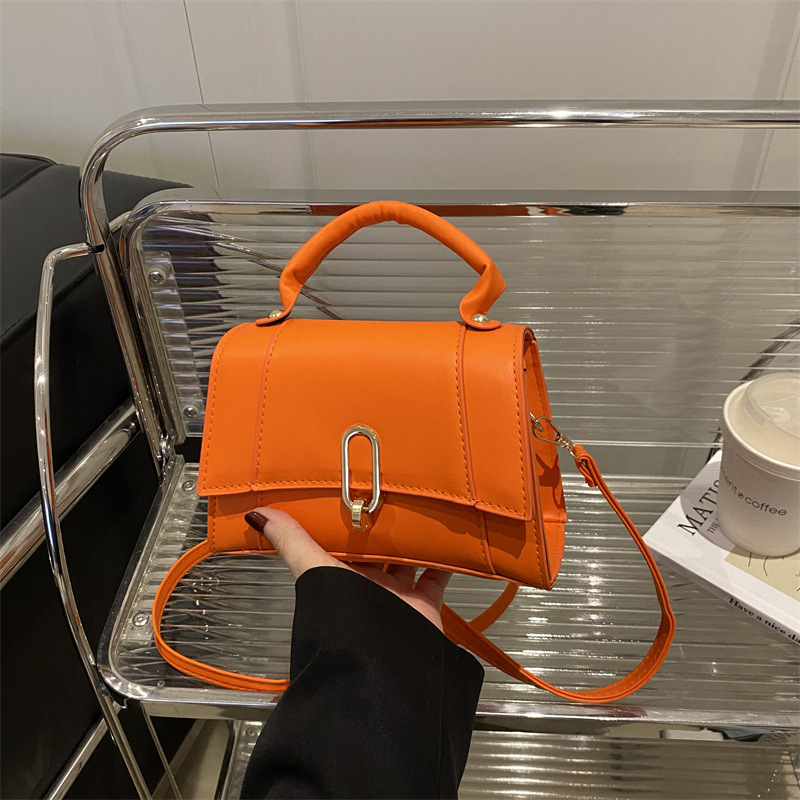 Bolso de mano coreano 2025 primavera nueva bolsa de moda de mujer con bloqueo de moda bolso de hombro simple de viaje