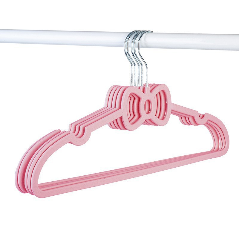 Arco de mariposa en forma de corazón rosa percha de plástico antideslizante para dormitorios de estudiantes adultos adorables soportes de secado