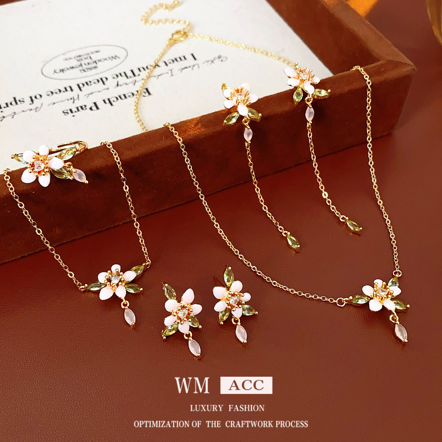Juego de flores de goteo de aguja de plata de galvanoplastia de oro real, anillo de pulsera de estilo de esmalte retro, collar de lujo ligero, pendientes de sentido avanzado
