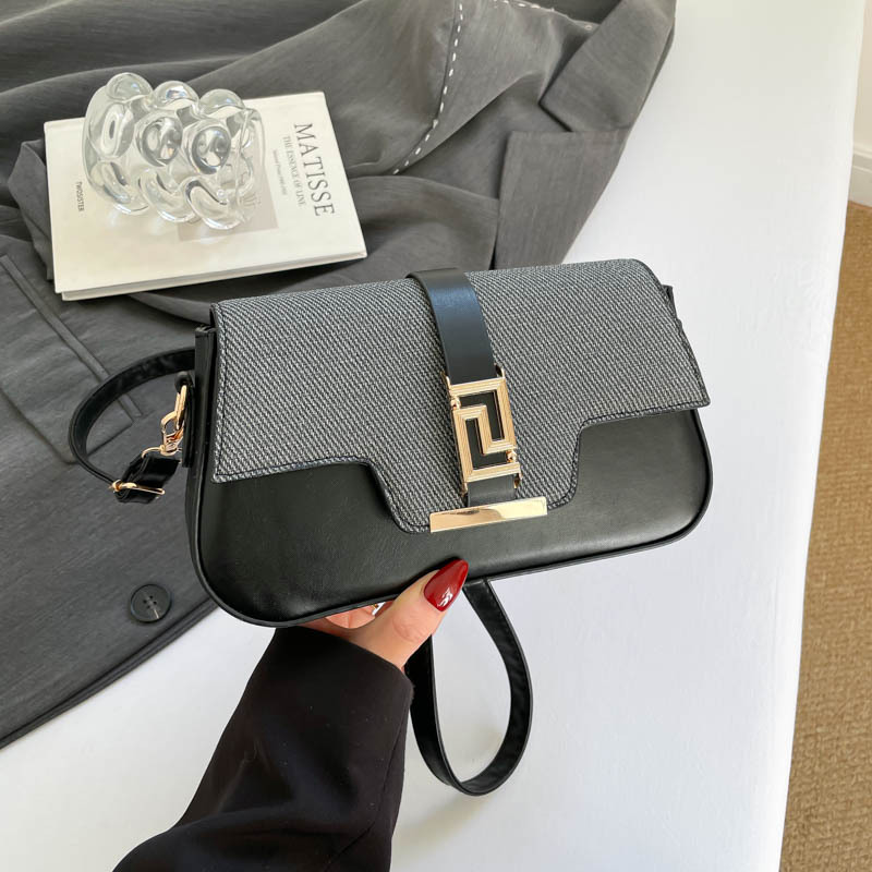 Nicho de diseño de alta sensación de silla de montar bolso para mujeres 2026 nuevo estilo coreano simple brazo de moda de hombro pequeño bolso