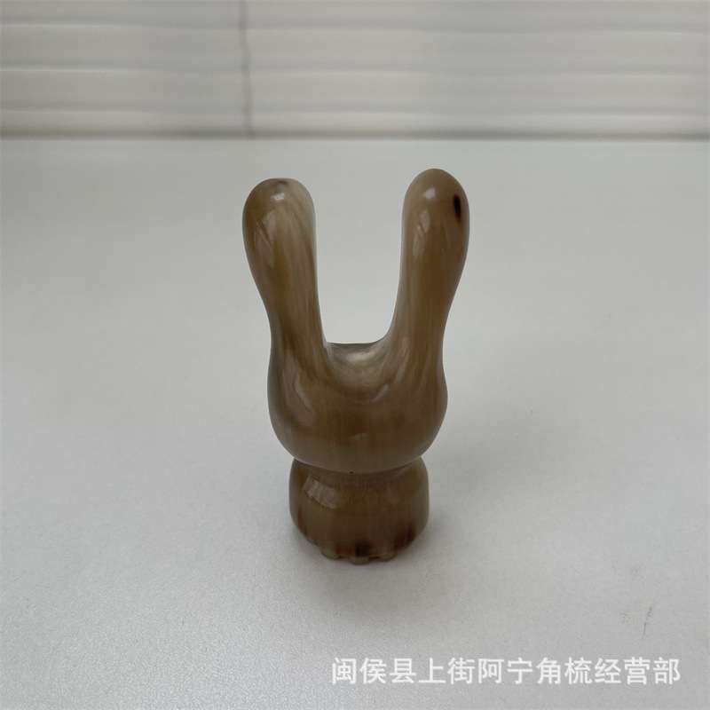Horn Facial Massage Tool Rabbit Ear Shape Guasha Scraper Portable Buffalo Horn Beauty Roller in use