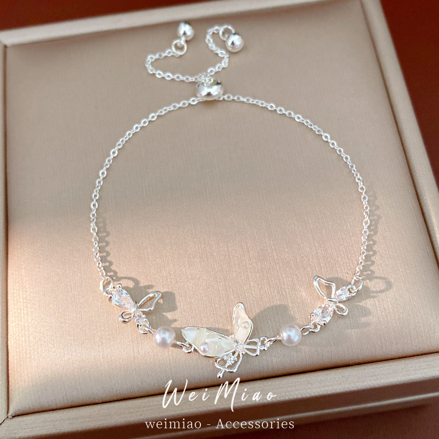 Pulsera de perlas de mariposa de marisco de marisco de piedra ligera de lujo de alto nivel de sensación de pulsera temperamento pequeño fresco y dulce joyería al por mayor