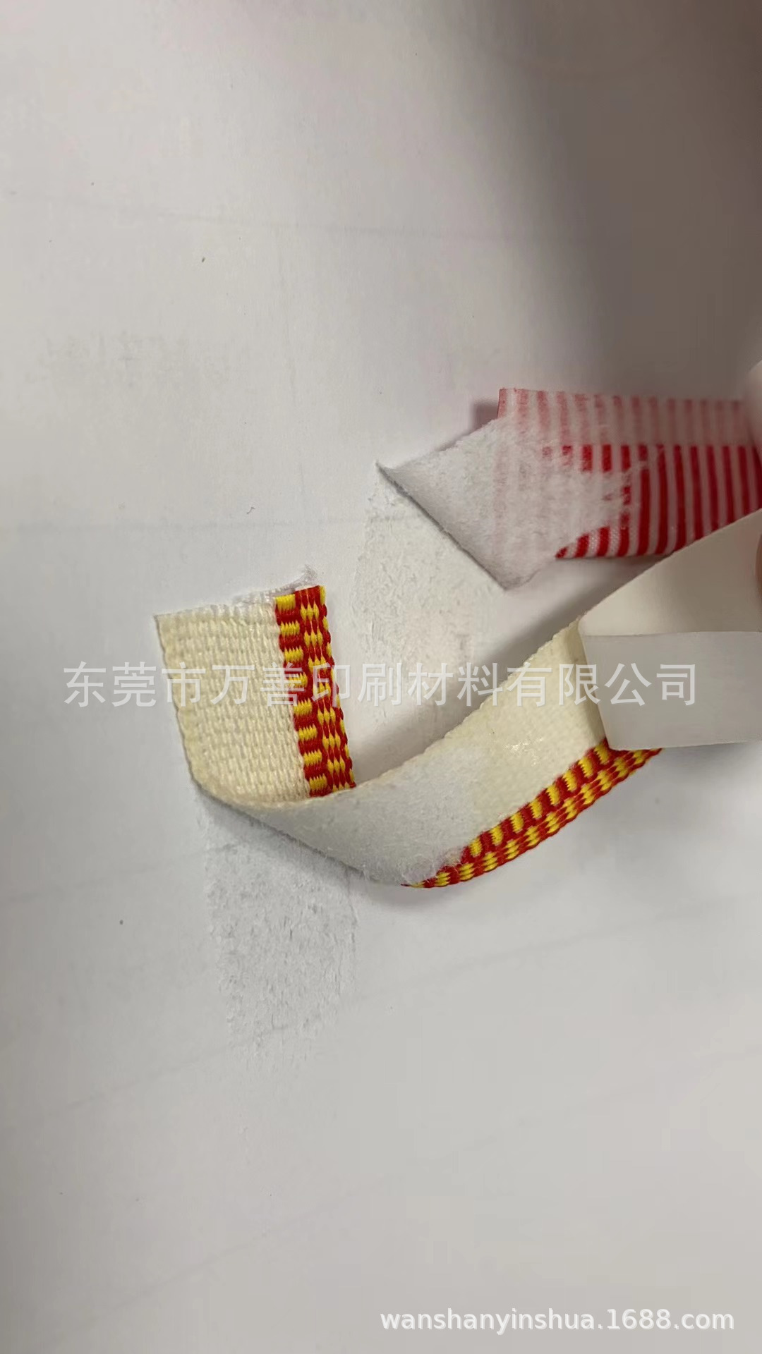 带胶笃头布图片