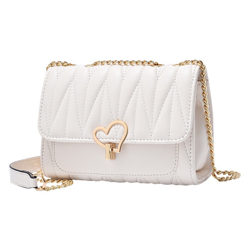 Bolso de mujer 2025 nuevo verano melocotón corazón con cerradura dulce bolso de hombro casual moda diagonal bolso femenino pequeño cuadrado al por mayor