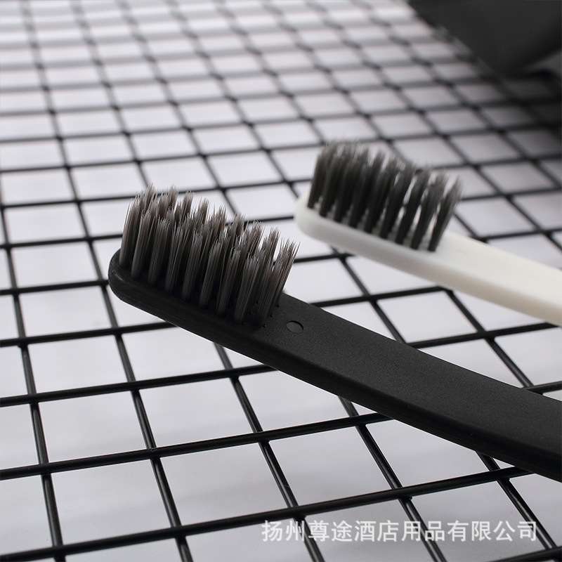 ホテルの洗面用品の卸売り民宿スリッパホテルの柔らかい毛の歯ブラシの使い捨ての歯具のシャンプーの入浴セット