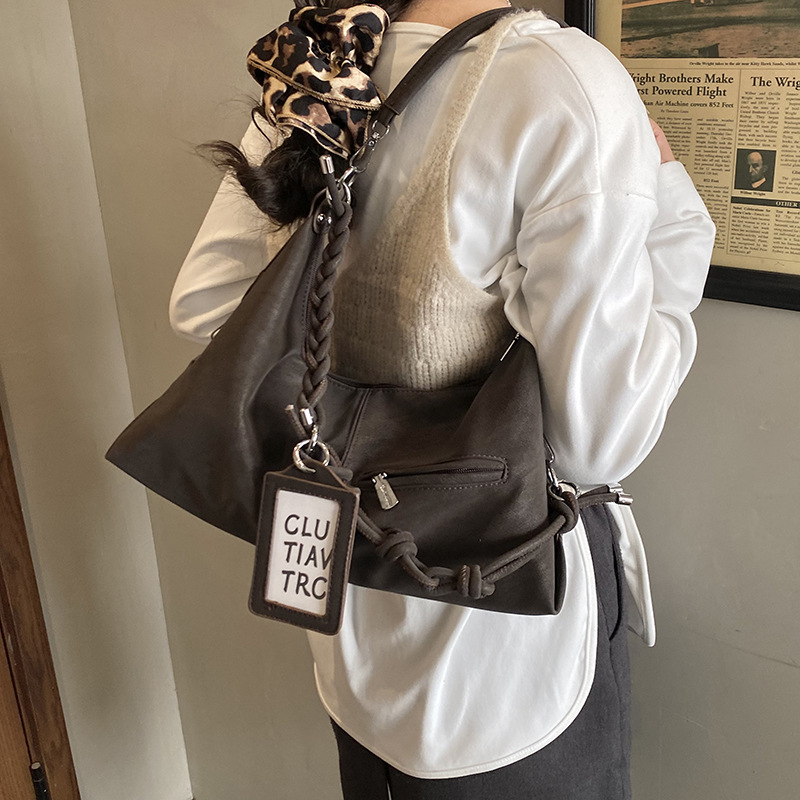 Bolsa de viaje transfronteriza de gran capacidad para mujeres 2025 nuevo estilo coreano de hombro casual bolso de brazo de alto nivel sensación de mochila