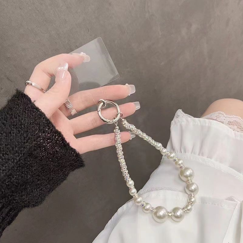 Ins Advanced Sense Super Flash Teléfono móvil Perlas de diamantes Adornos para teléfonos móviles Cadena anti-pérdida de todo fósforo Cadena para teléfonos móviles con lazo