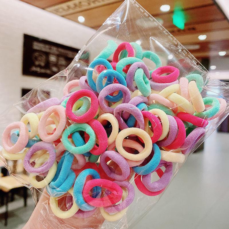 Banda de goma de bebé Corea del Sur banda de pelo de los niños anillo de toalla de color caramelo bolsa de Margarita banda de pelo OPP bolsa cuerda de pelo banda de goma al por mayor