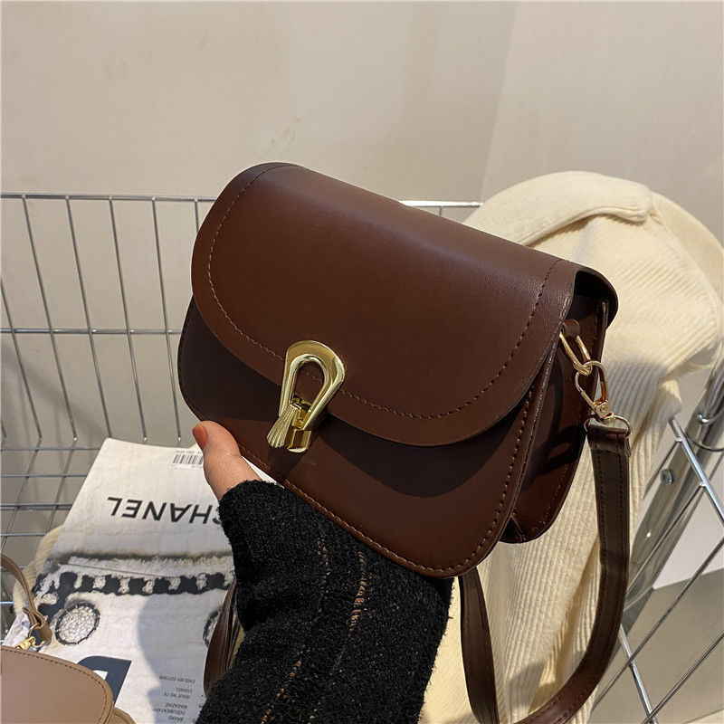 シンプルな質感の小さいカバンの女性の新型の夏のファッションの通勤の斜めのショルダーバッグの洋風の百合のロックのショルダーバッグの卸売り|undefined