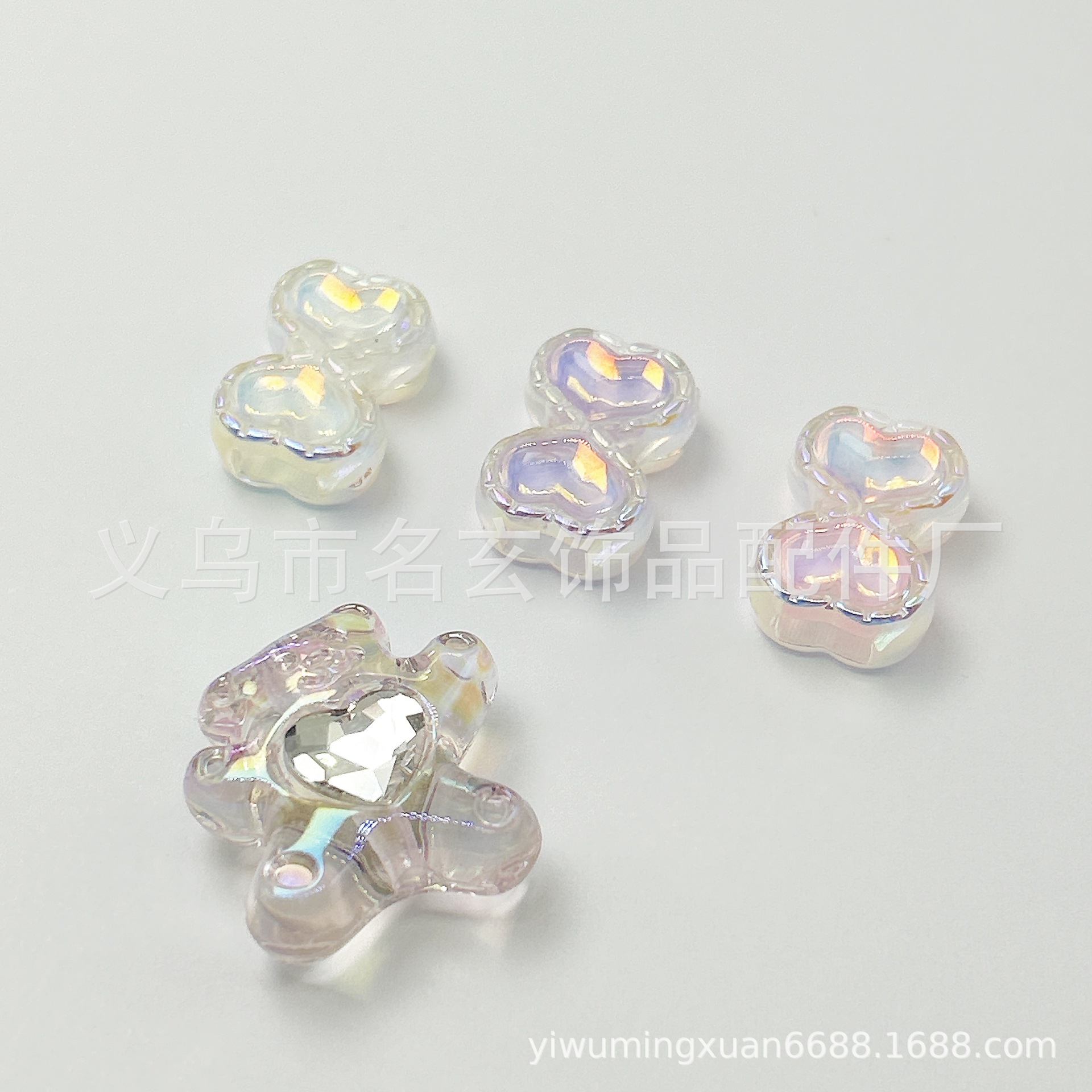 Acrylic double-sided beads with zircon with bow