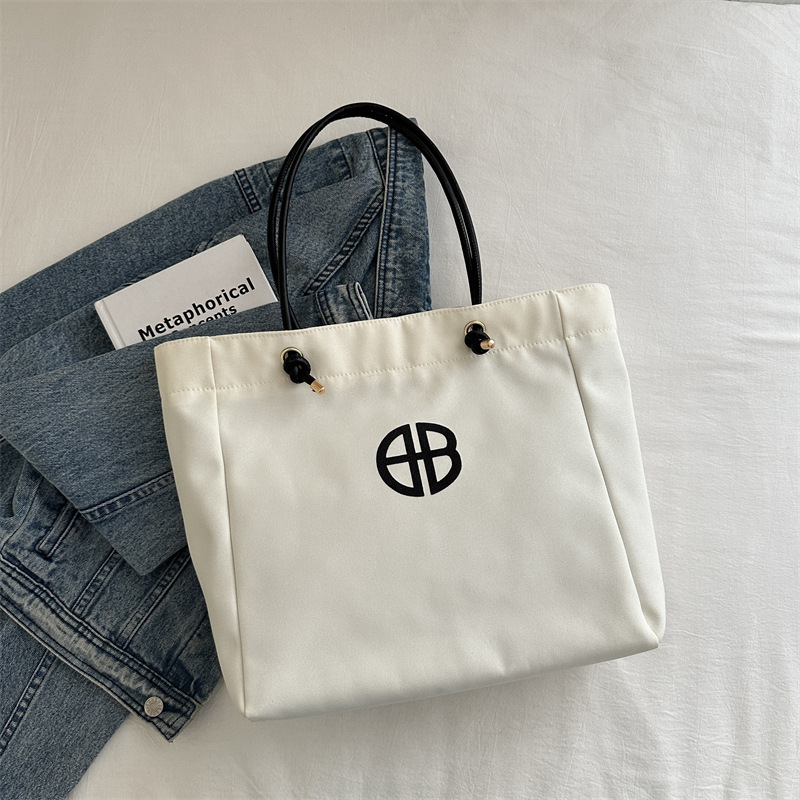 Bolsa de lienzo de gran capacidad de letras para mujeres este año nueva bolsa de hombro de moda universal bolsa de viaje bolsa de mano bolsa de mamá