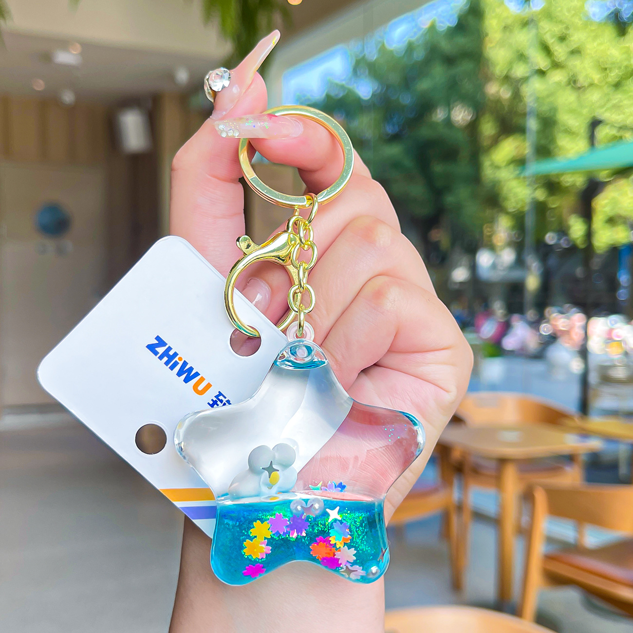 Nuevo aceite de arenas movedizas llavero lindo deriva botella de arenas movedizas colgante coche de dibujos animados llavero pequeño regalo al por mayor