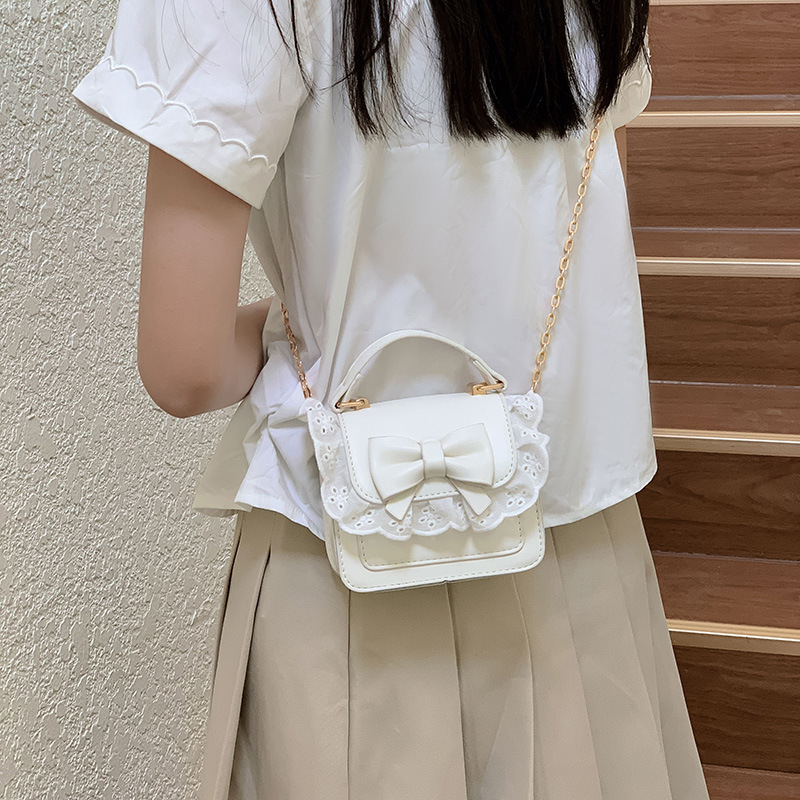 Bolsos de hombro de encaje extranjero para hombres y mujeres, bolsas de cadena de arco mini lindas coreanas nuevas bolsas para niños