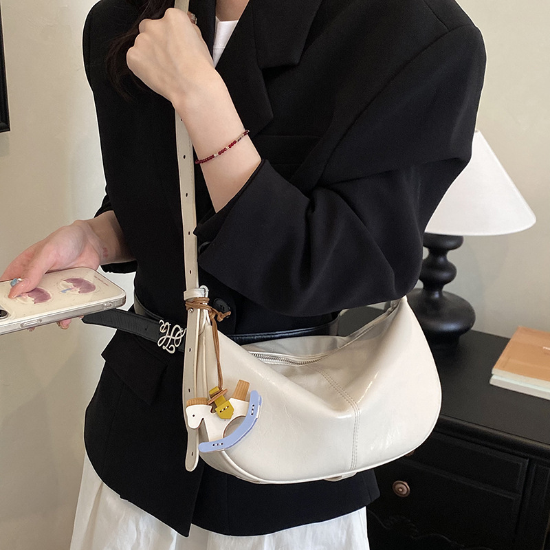 Este año, bolsas de bolinillos populares y simples para mujeres 2026 nuevas texturas diarias de mochila de viaje, bolsas personales de ropa de cama casuales