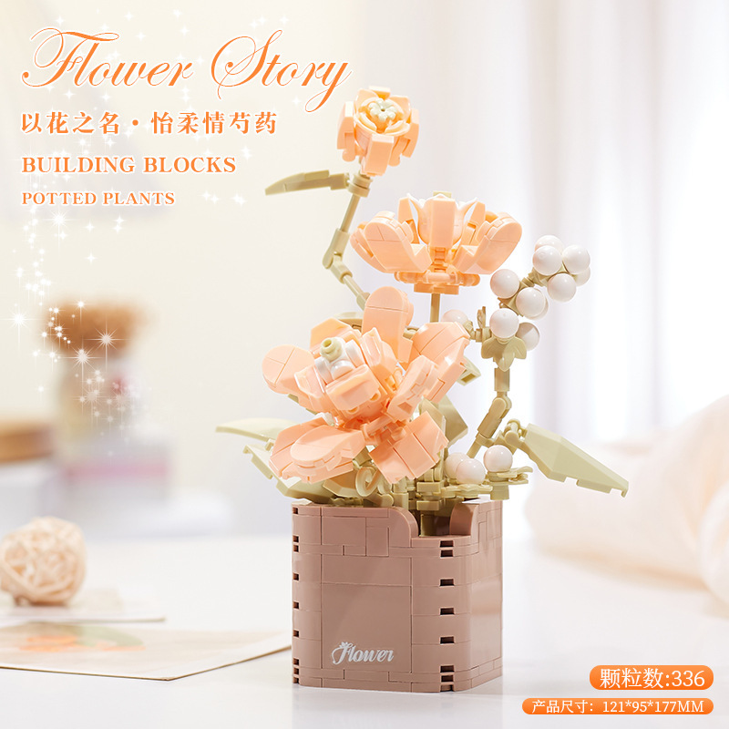 積み木の花がバラのオルゴールを飾っています。|undefined