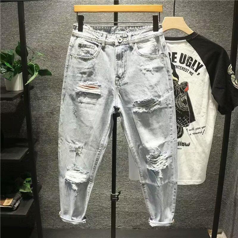 Męskie jeansy vintage z przetarciami o prostym i luźnym kroju_voghion.com