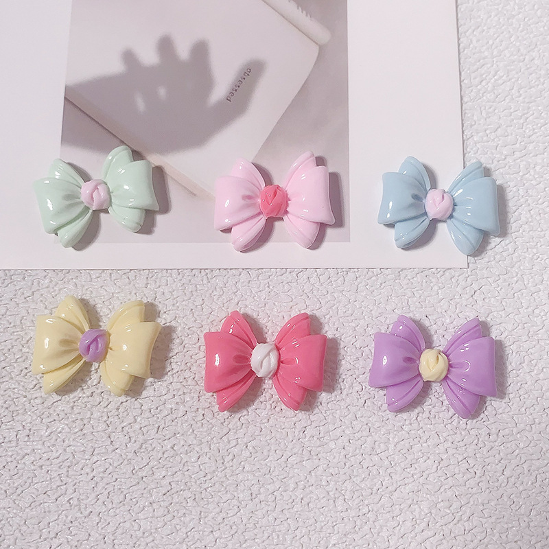 Nuevos accesorios de resina de color macaron de lazo de dibujos animados