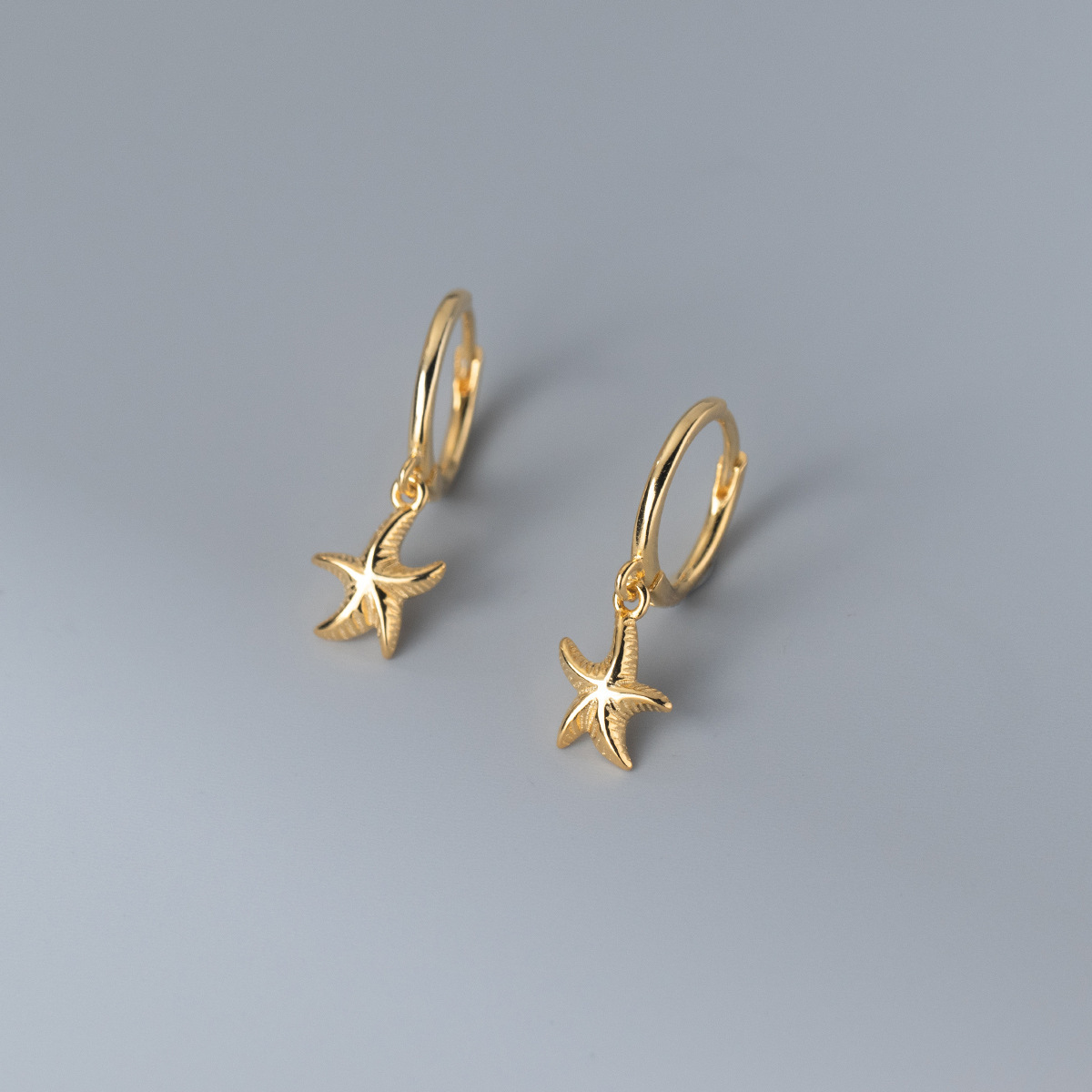 Eloch s925 plata elementos marinos simplista dulce estrella de mar auriculares frescos japoneses y coreanos auriculares mujeres M01211