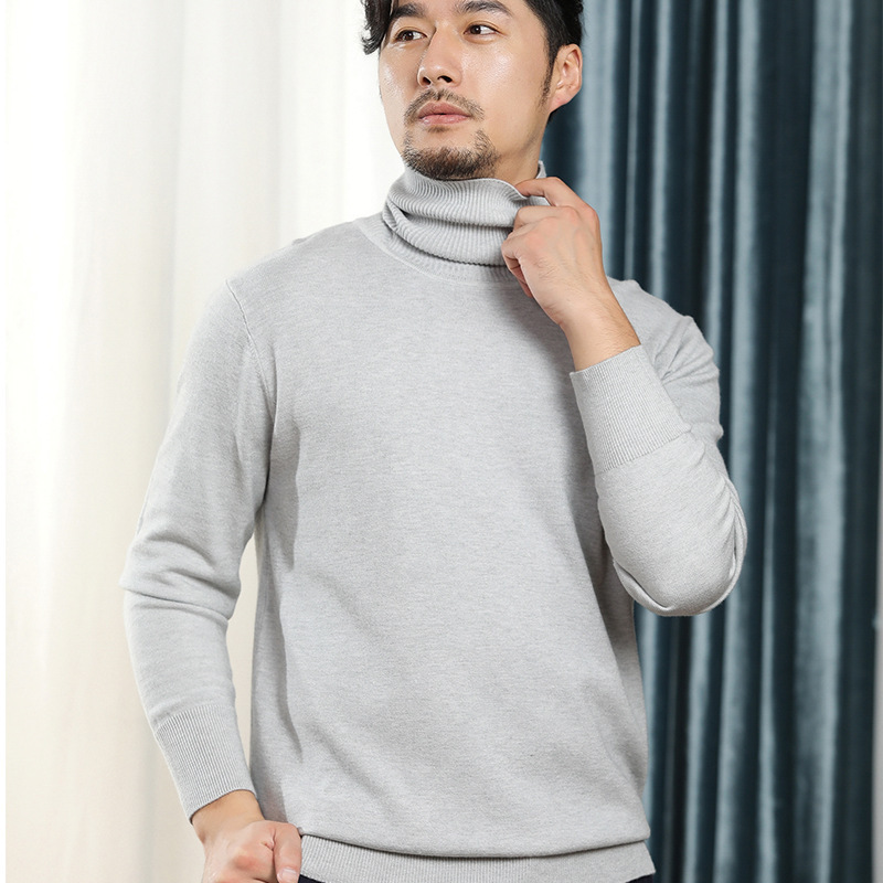 秋冬の新型男性韓国版高襟のニットの純色のビジネス男性は大きいサイズのゆったりしたセーターを打ちます。