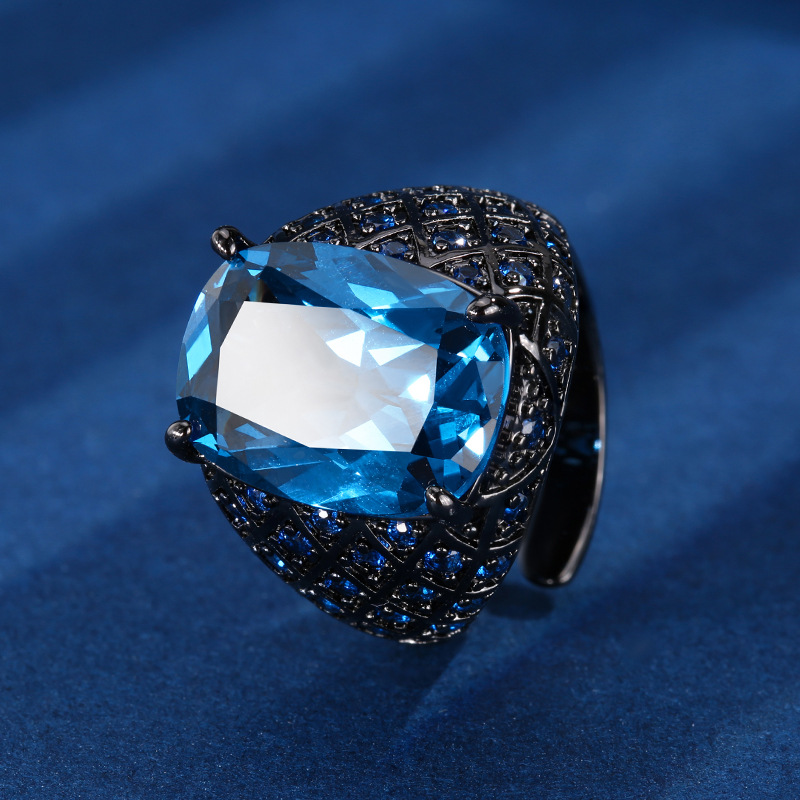 Otoño e invierno nuevo estilo Zhuang Shengsheng joyería fondo de cobre chapado en oro simulación cristal puntiagudo azul anillo retro mujer piedra 12*16