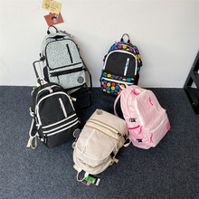 一件代发时尚休闲双肩包KW大容量学生书包电脑包户外运动旅行背包