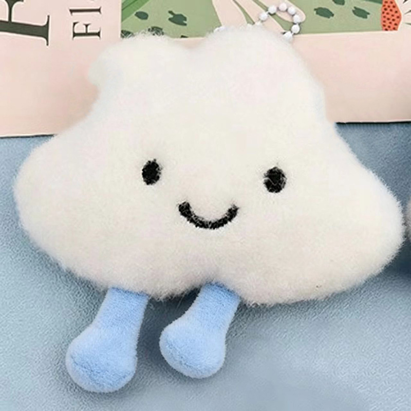 Procesamiento personalizado 2026 nuevo dibujos animados peluche nube mochila decoración colgante muñeca sonriente accesorios muñecas en línea