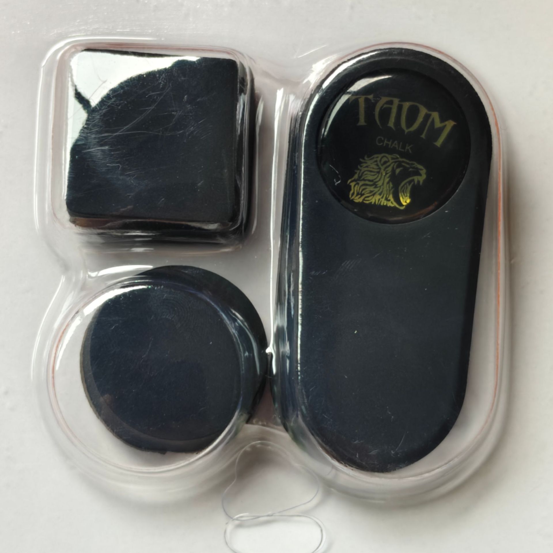 A set of Tawum gold label black chocolate clips