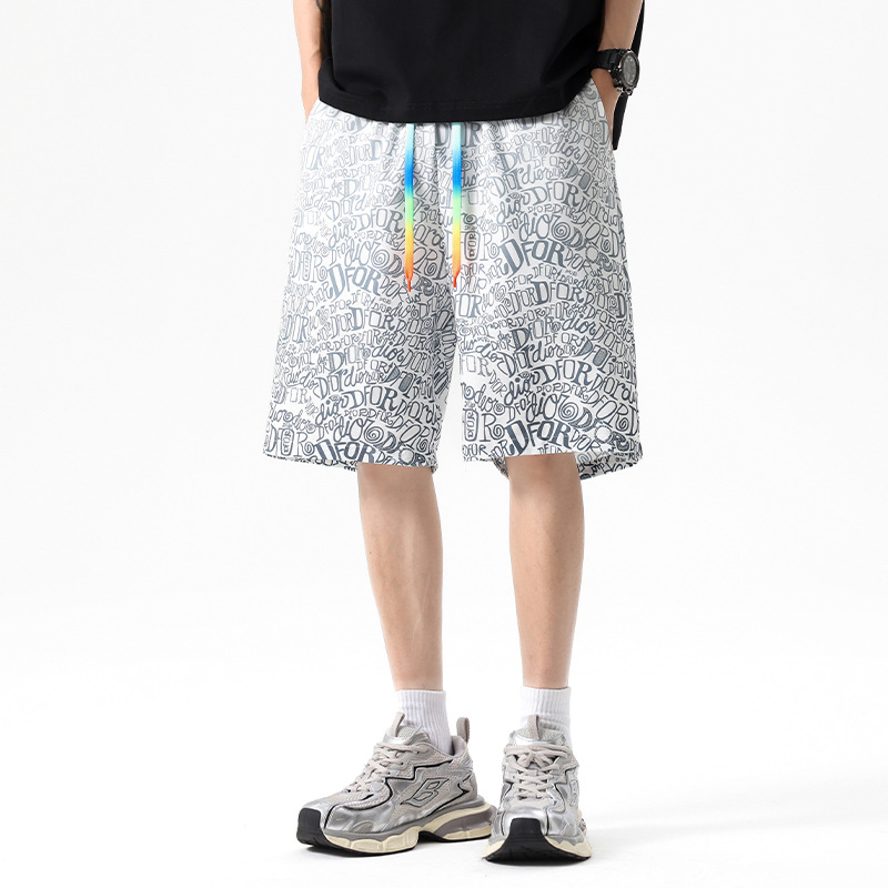 Verano nuevo estilo adolescente pantalones cortos deportivos moda casual gradiente pantalones cortos de camuflaje pantalones sueltos de playa