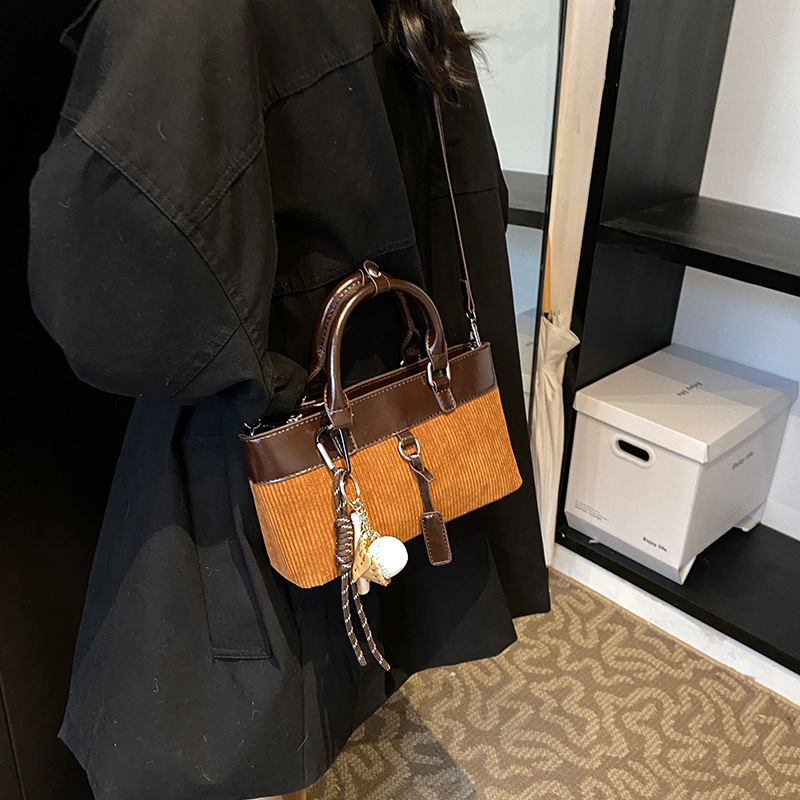 Retro nicho bolso de cubo de color contraste mujer 2025 nuevo otoño invierno versátil bolso de hombro de moda bolso de mano