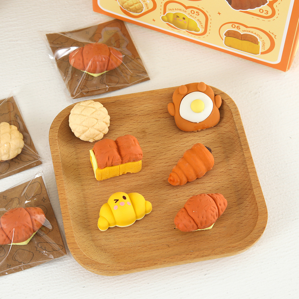 Nuevos productos Yuanqi desayuno simulación de alimentos juegan borracha de goma de papelería de estudiantes limpieza borracha de goma de ensamblaje inteligente