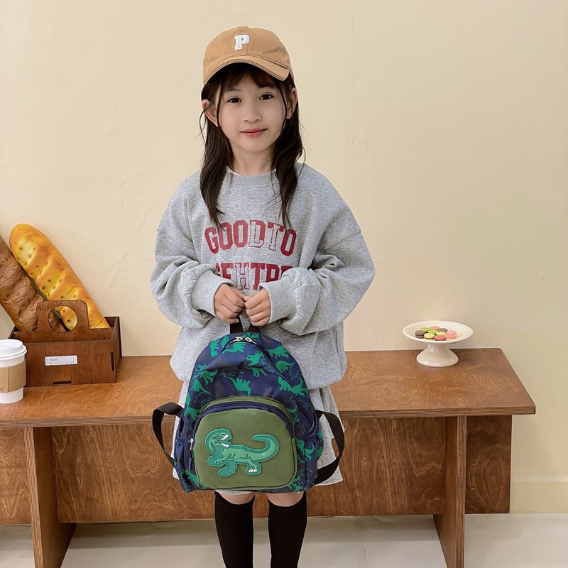2025 nueva mochila de dinosaurios infantil impresa de dibujos animados encantadora mochila para estudiantes de jardín de infantes