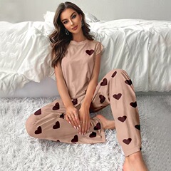 欧米の国境を越えた牛乳の糸の新型の小さい飛袖の女性の家の服のプリントの純色の薄いパジャマのスーツは外で着ることができます。