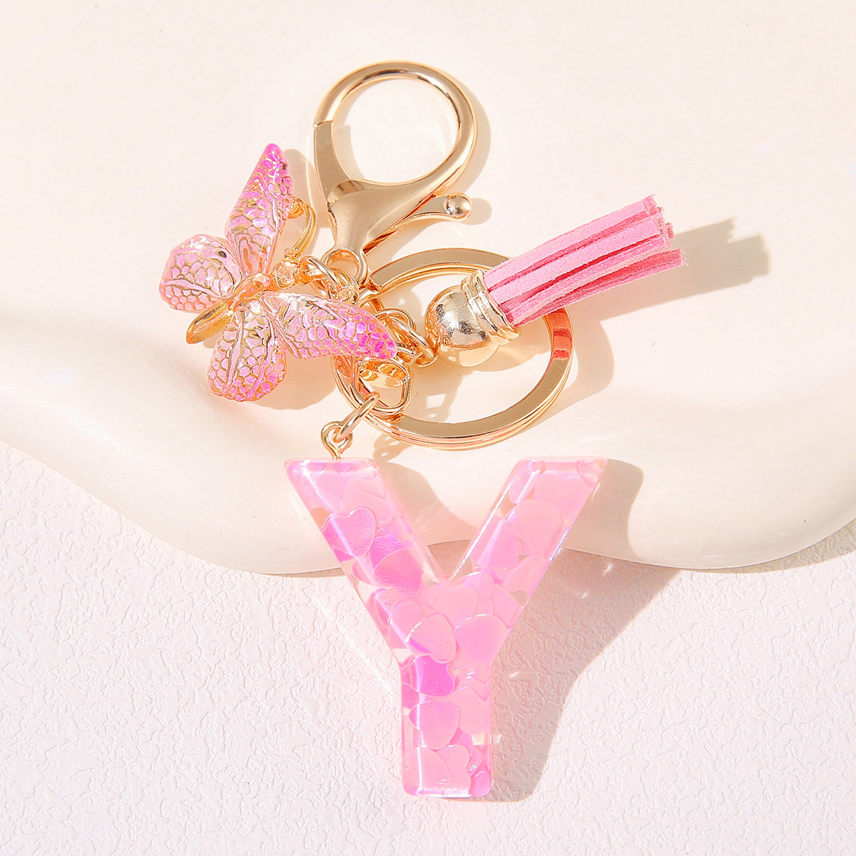 Nuevo rosa damas letras A-Z llavero de goteo de goma sequilla amor letras bordas mariposa llavero transfronterizo