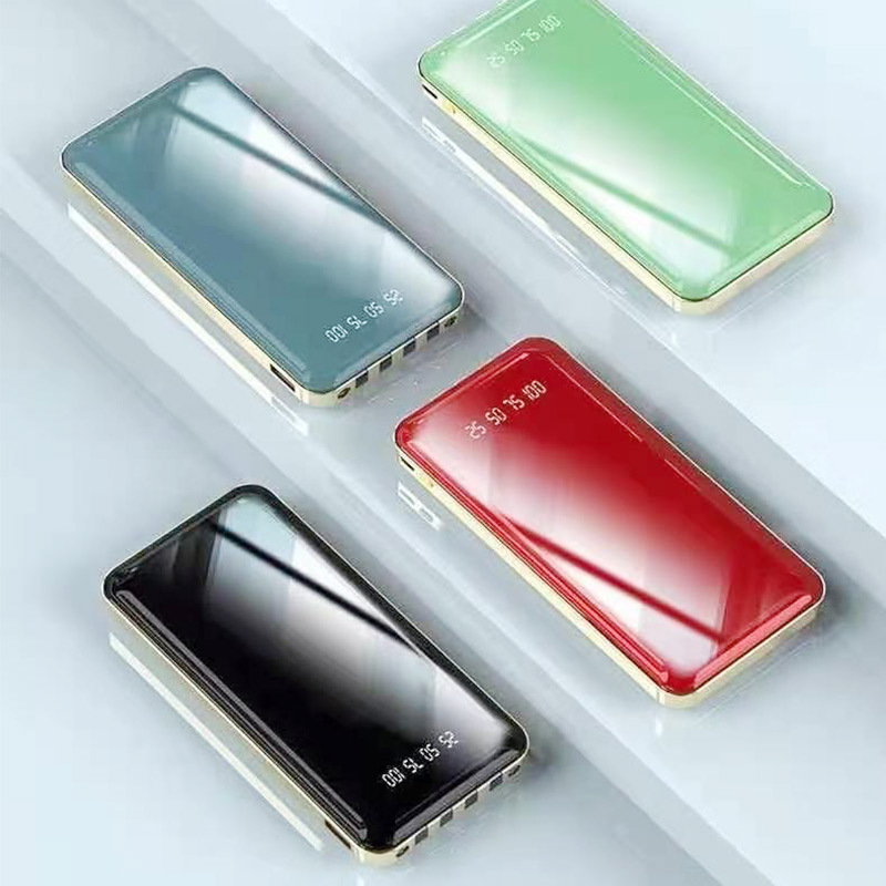 Teléfono móvil portátil cargador tesoro de viaje al aire libre con cuatro líneas de salida espejo poroso fuente de alimentación móvil para compartir stock