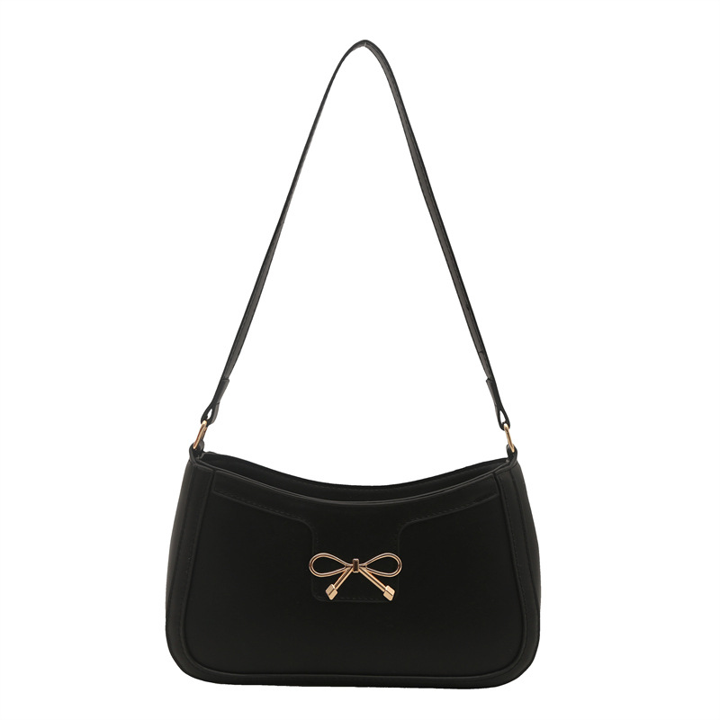 Bolso de hombro popular de este año con lazo para damas de gran capacidad 2025 color sólido nuevo bolso de axila simple de textura de moda