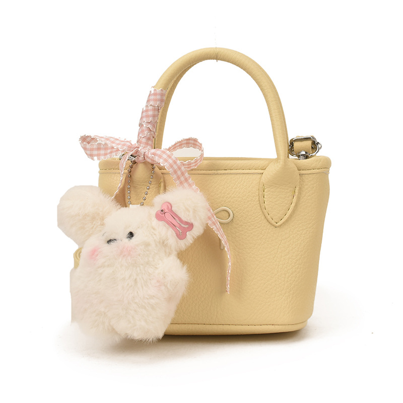 Bolsa de balde coreana para niñas estilo extranjero simple color sólido mini bebé bolsa de cesta de verduras 2026 nuevo bolso para niños