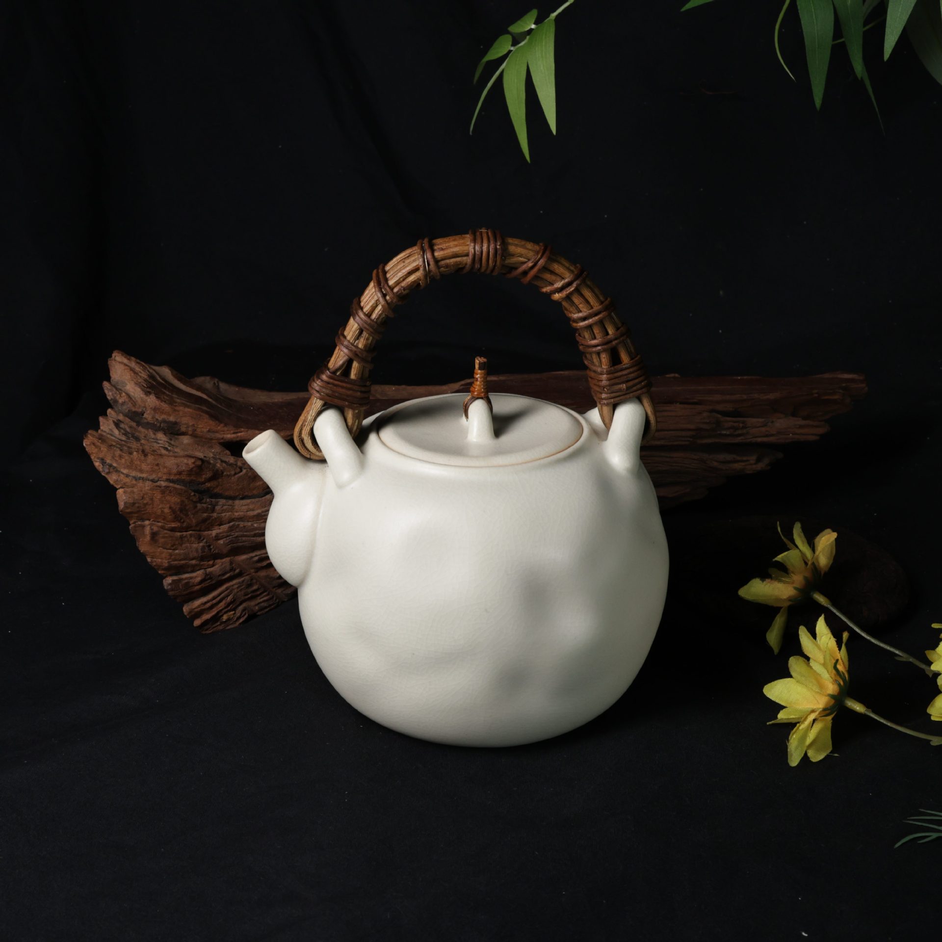 Handmade soda glaze teapot with natural rattan handle and crackle glaze, suitable for electric ceramic stoves, wholesale.