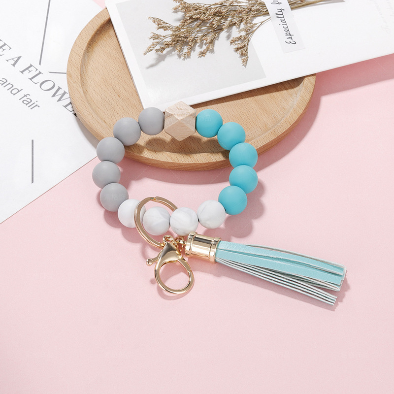 Simple and Elegant Keychain Food Grade Silicone Bead Bracelet Keychain Women's European and American Leather Tassel Bracelet Keyring