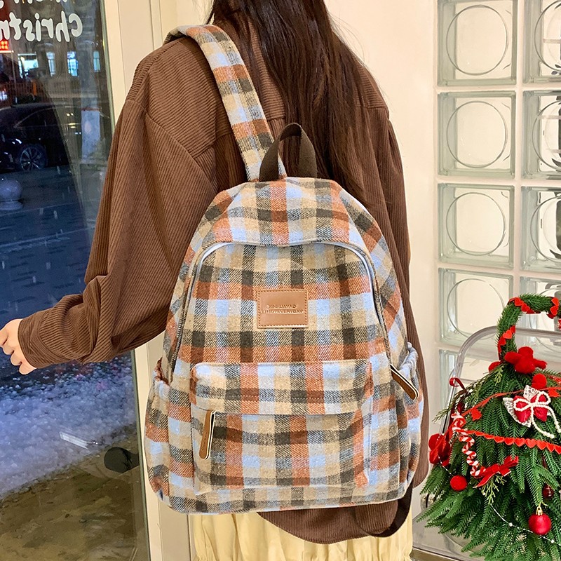 Mochila versión coreana de la versión coreana de la cuadrícula cuadrada de gran capacidad, mochilas escolares para estudiantes de secundaria y secundaria son simples y completas con paquetes de viaje de corta distancia.