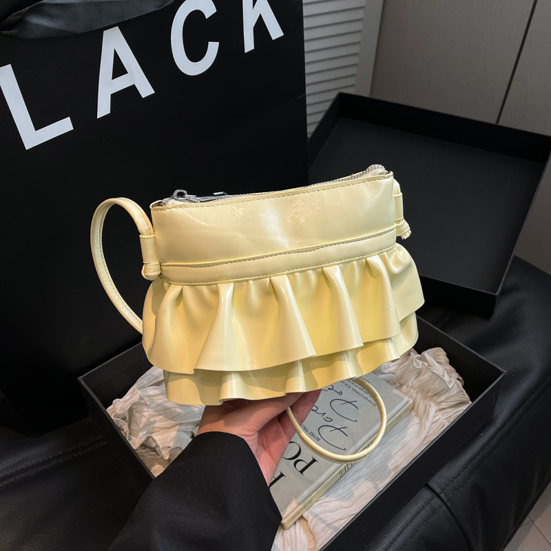 Bolso pequeño de moda coreana 2025 verano nuevo bolso femenino plisado con volantes bolso bandolera salvaje estilo occidental