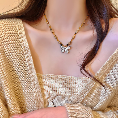 Bohemian-style butterfly necklace for women, featuring a new Chinese retro bead sweater vest chain, a niche temperament necklace.