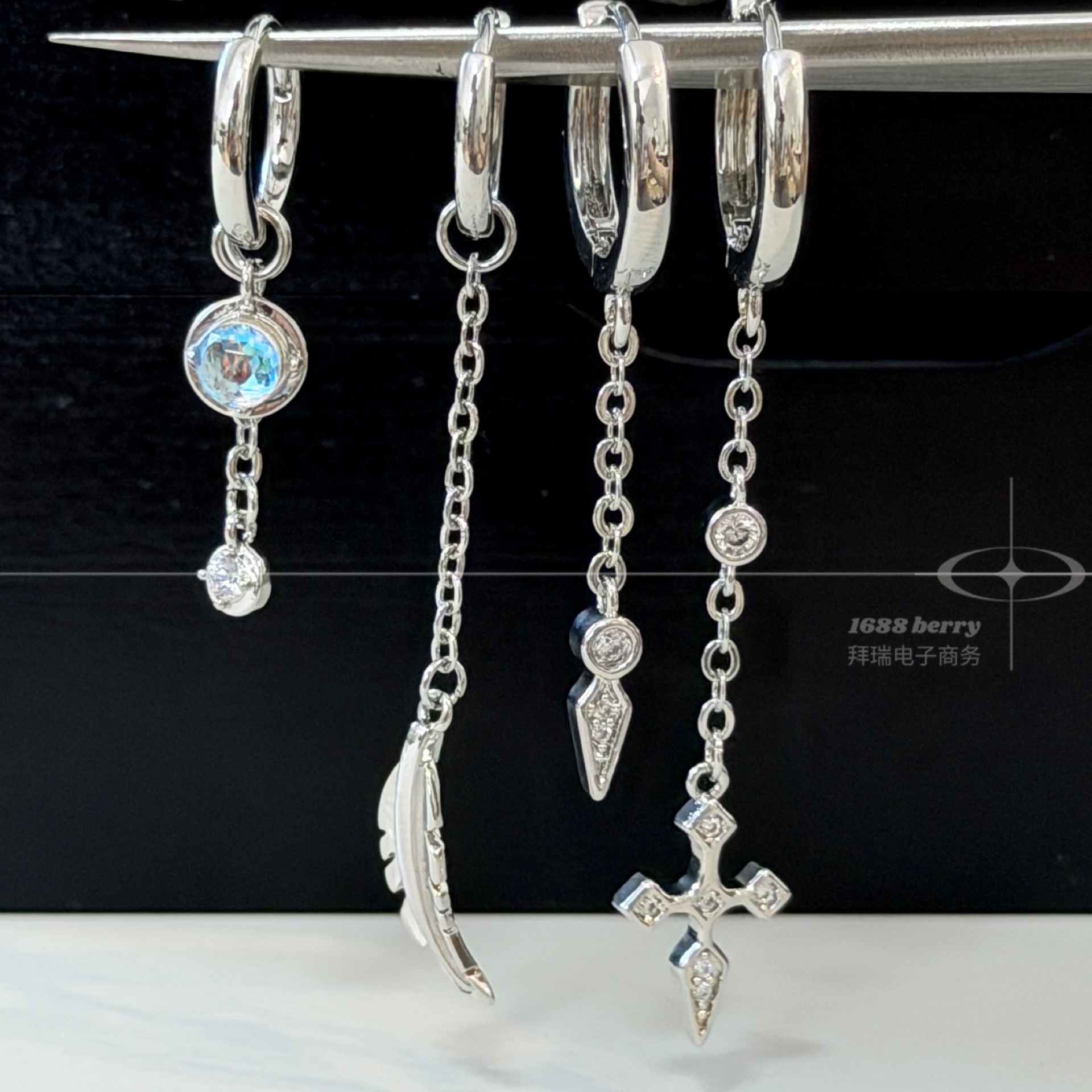 Asymmetrical hoop earrings for women, featuring feather, moonstone, and diamond-encrusted cross pendants, trendy and stylish, with a high-end and luxurious feel, popular among influencers